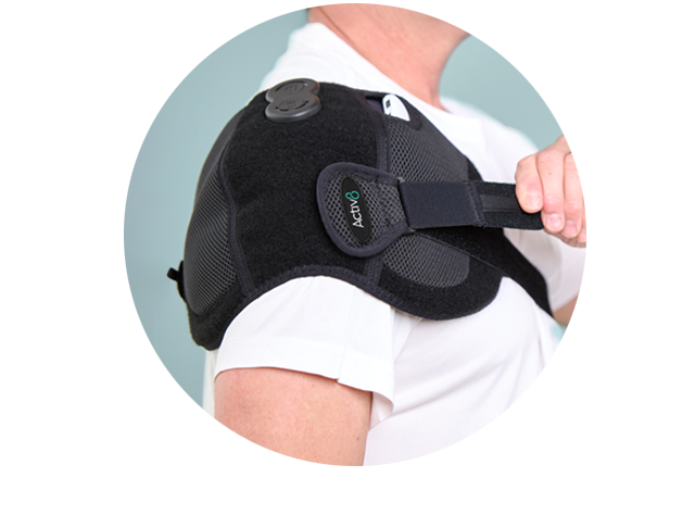 Man wearing the Activ8 Shoulder device, pulling the strap to adjust the fit.