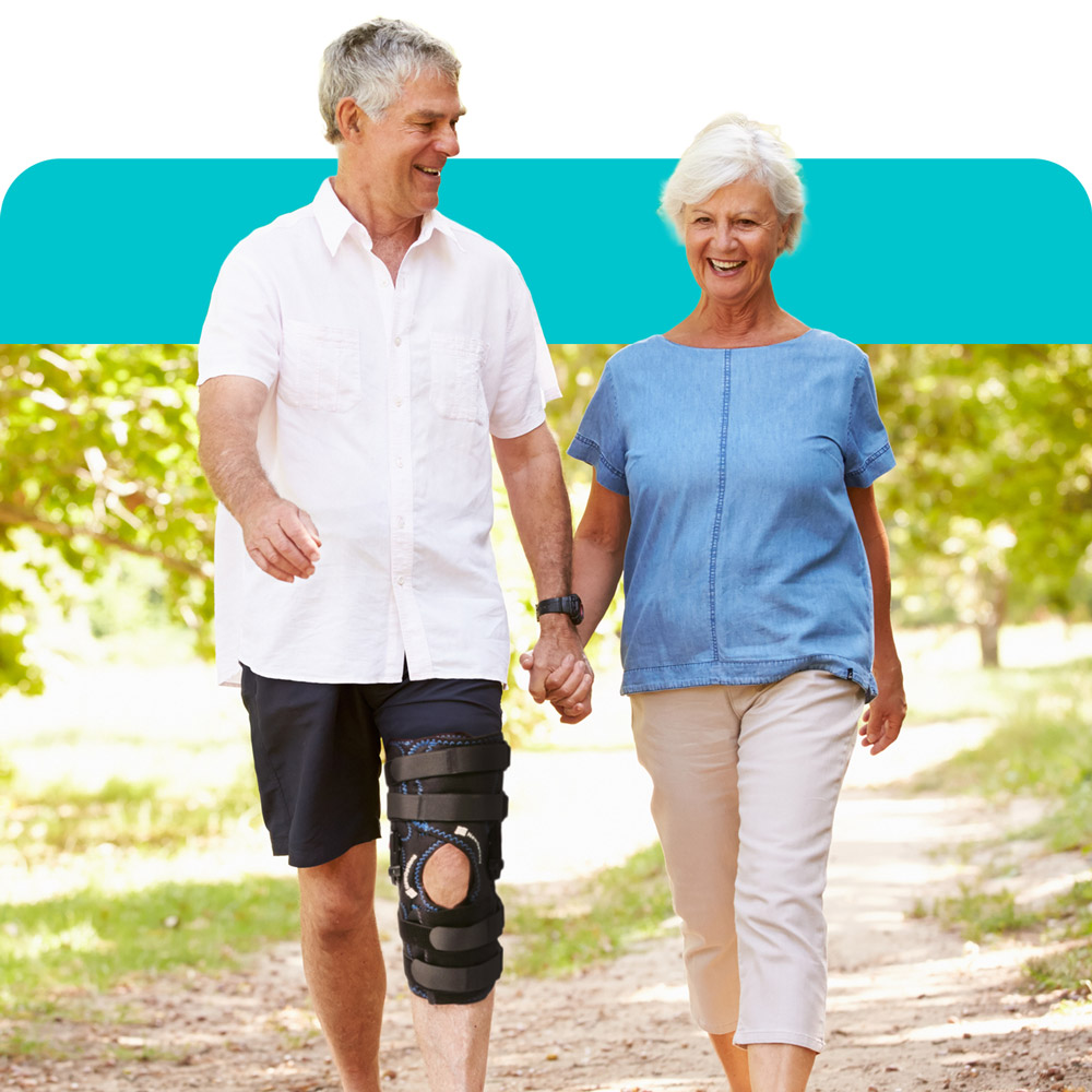 a woman and man on a walk and the man is wearing a knee brace