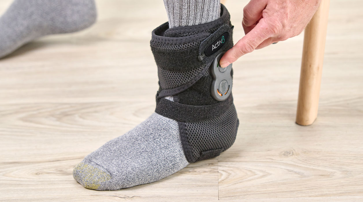 A person wearing an Activ8 System brace to support their ankle