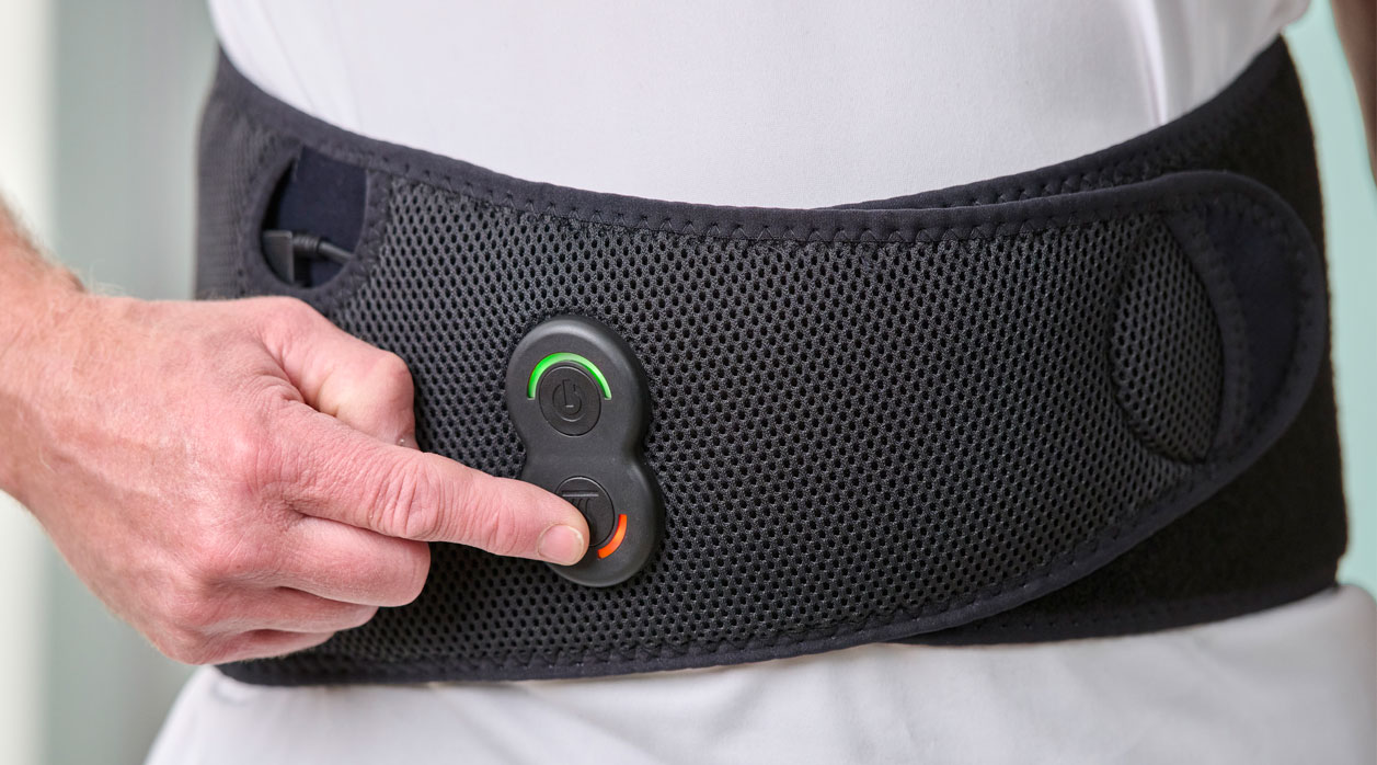 A person wearing an Activ8 System brace to support their back