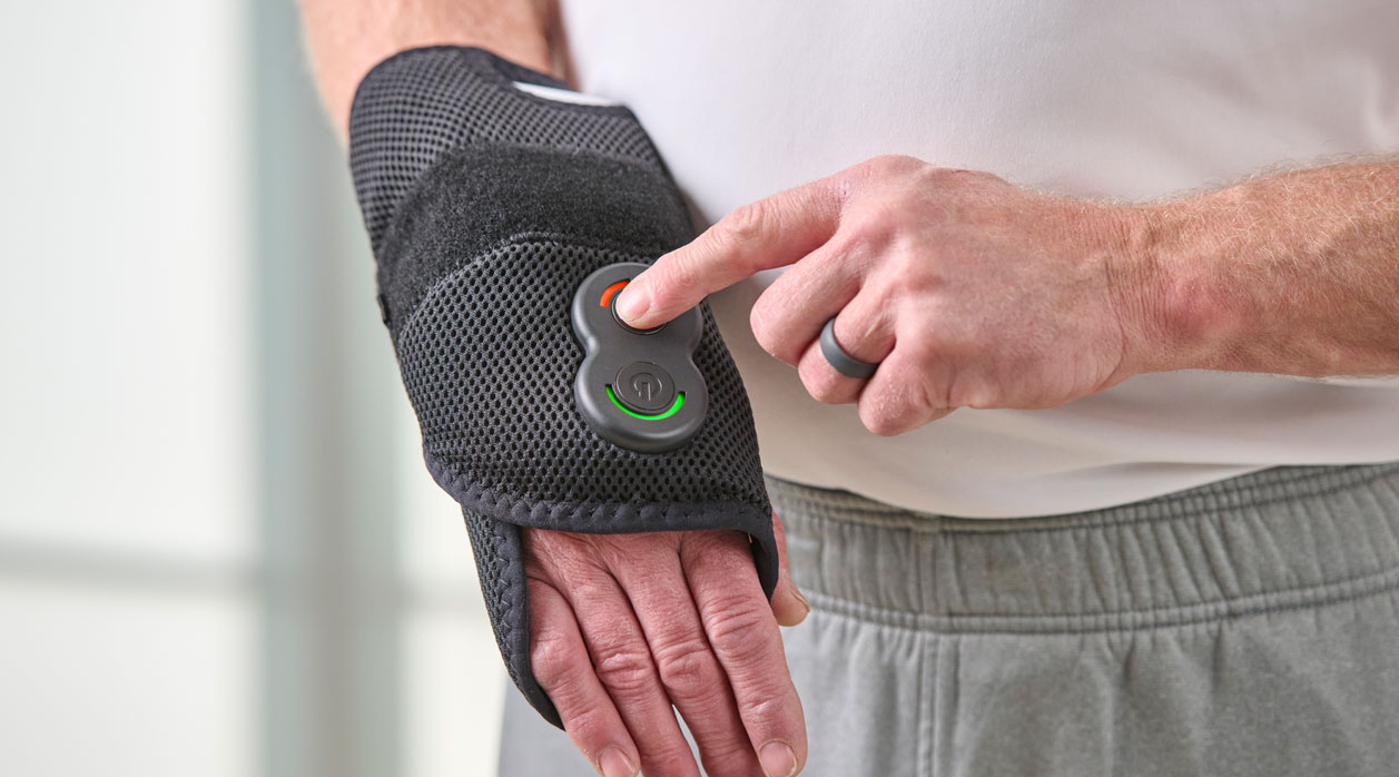 A person wearing an Activ8 System brace to support their hand and wrist
