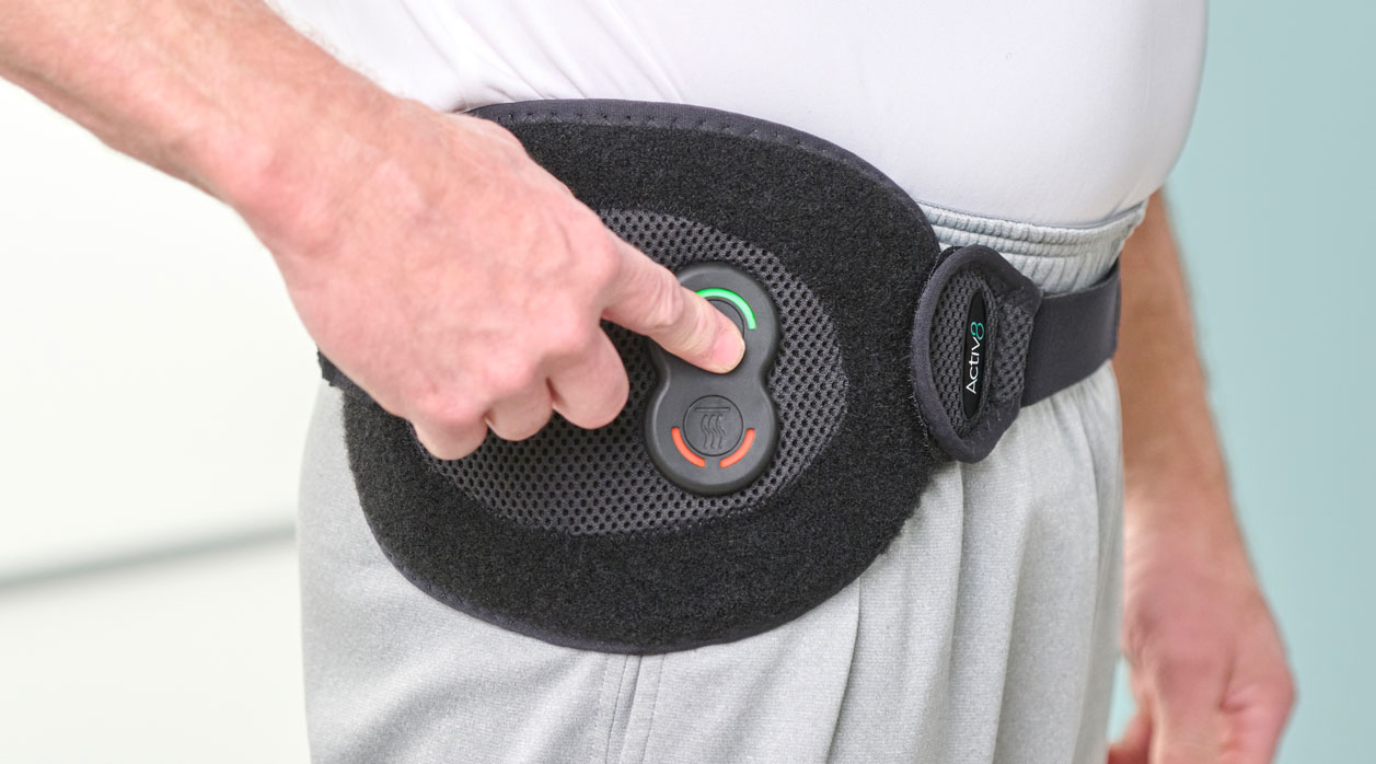 A person wearing an Activ8 System brace to support their back