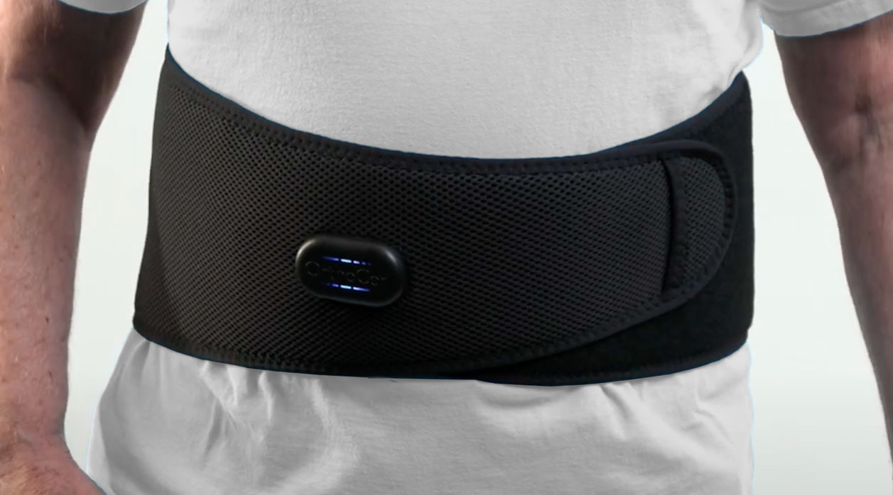 A person wearing an Active System around their waist for back support